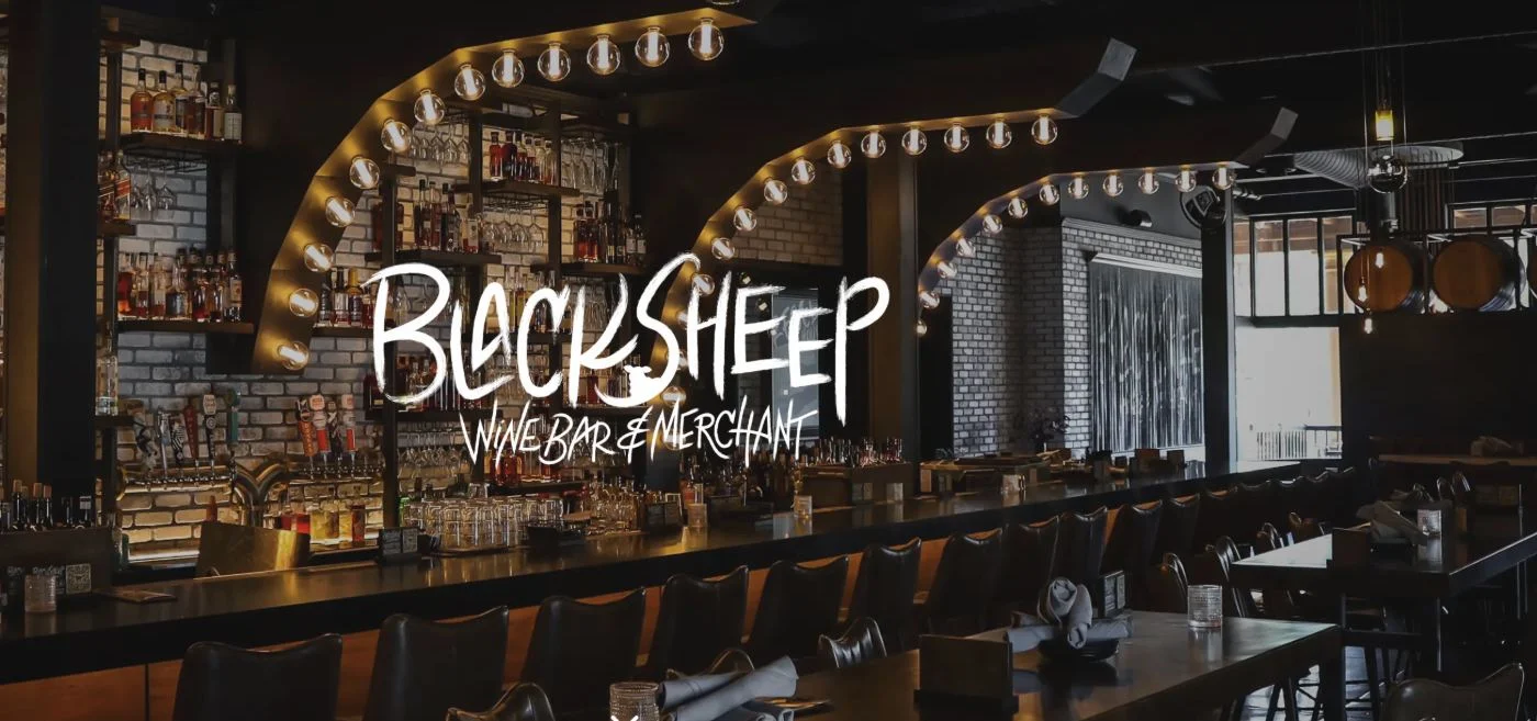 The softly lit arches and bar at BlackSheep Wine Bar & Merchant